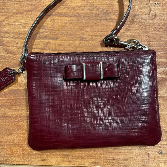 Coach Accessories - Burgundy Coach wristlet